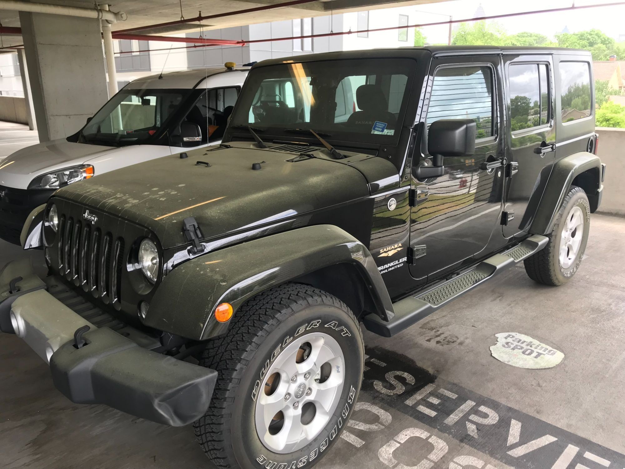 Dusty Jeep Wrangler Sahara — before Loop service